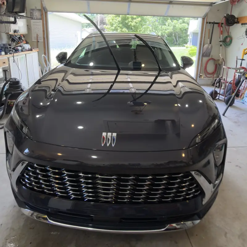 Front of a dark gray Buick Envista in a garage after detailing