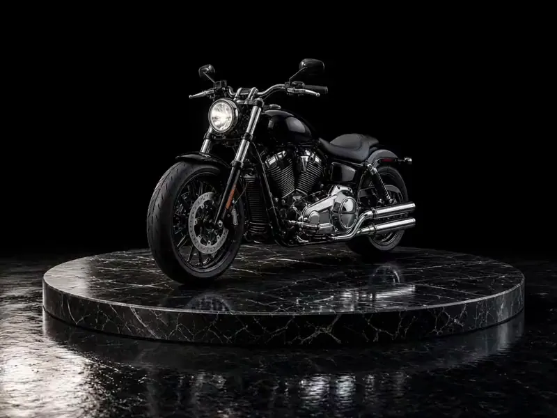 Black cruiser motorcycle on a studio turntable