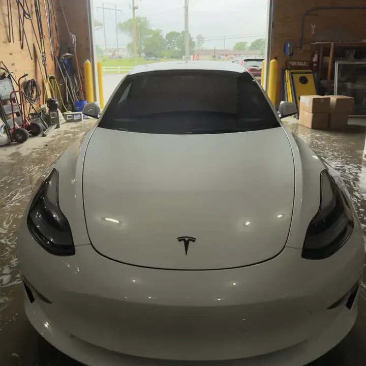 White Tesla front end after paint protection