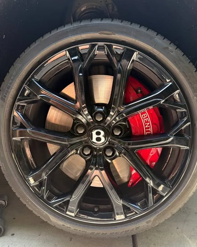 Bentley wheel after curb rash repair, rim edge restored