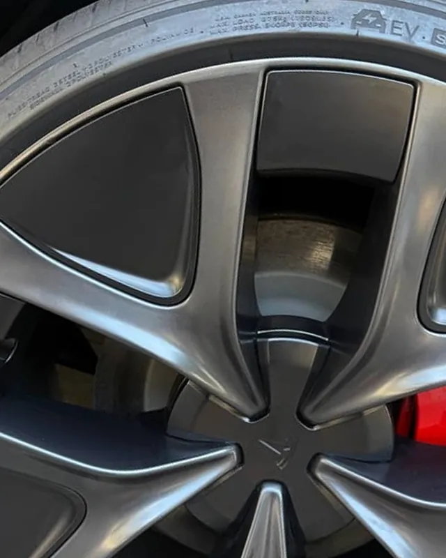Tesla Model 3 wheel after curb rash repair, rim edge restored